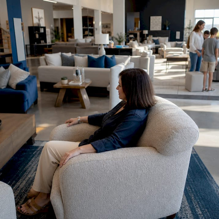 Customer testing furniture in showroom