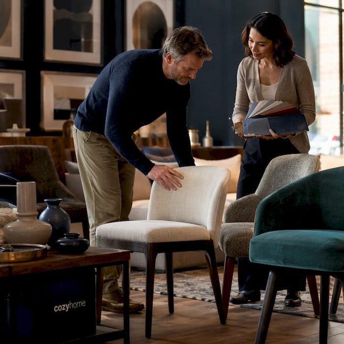 Customer consulting sales associate in furniture showroom