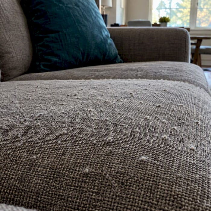 Pills visible on a sofa seat fabric